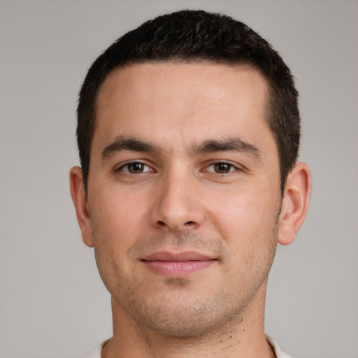 Joyful white young-adult male with short  brown hair and brown eyes