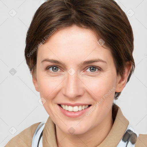 Joyful white young-adult female with medium  brown hair and grey eyes