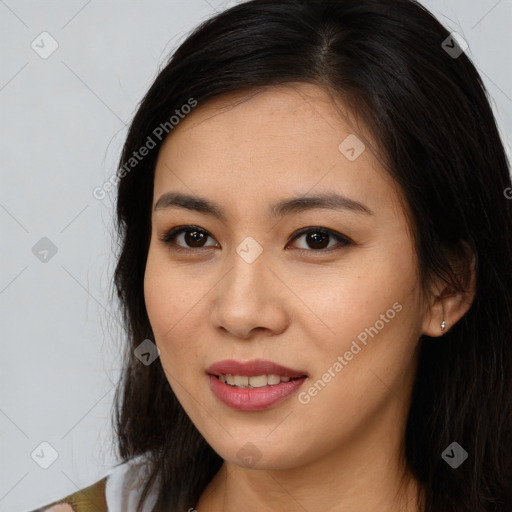 Joyful asian young-adult female with long  brown hair and brown eyes