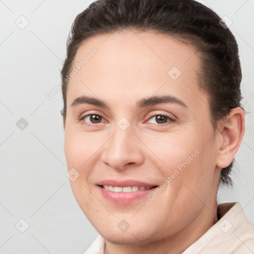 Joyful white young-adult female with short  brown hair and brown eyes