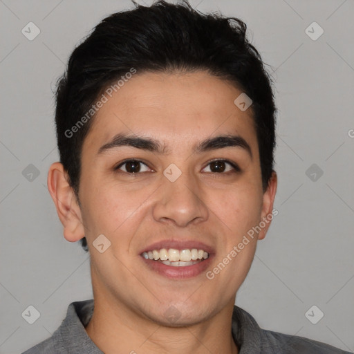 Joyful white young-adult male with short  black hair and brown eyes