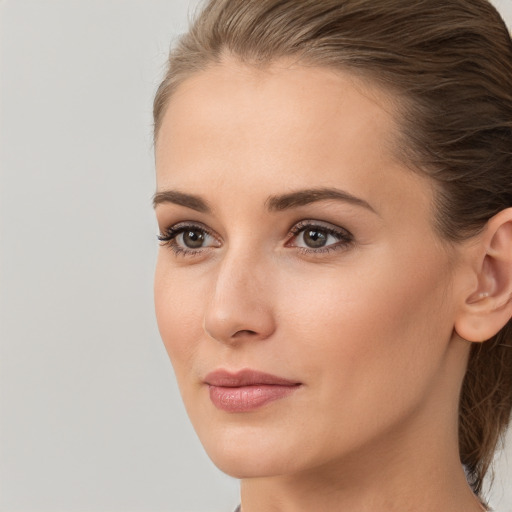 Neutral white young-adult female with medium  brown hair and brown eyes