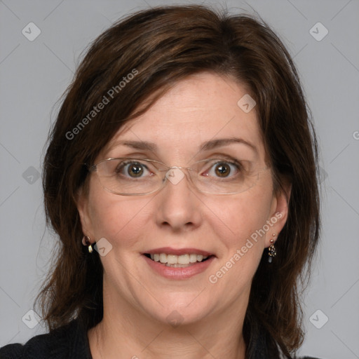 Joyful white adult female with medium  brown hair and green eyes