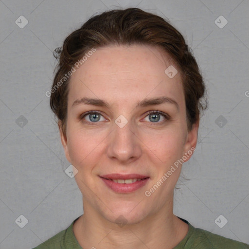 Joyful white adult female with short  brown hair and grey eyes