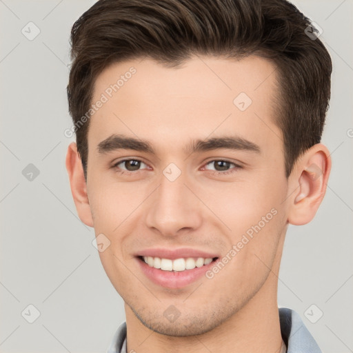 Joyful white young-adult male with short  brown hair and brown eyes