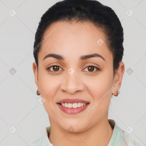 Joyful latino young-adult female with short  brown hair and brown eyes