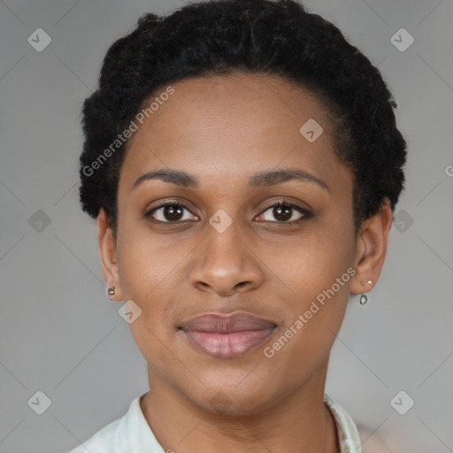 Joyful black young-adult female with short  black hair and brown eyes