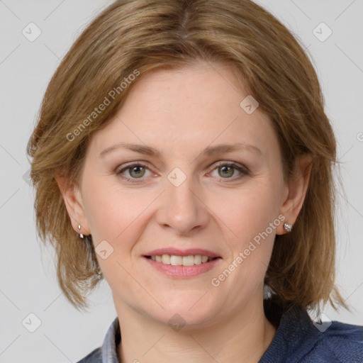 Joyful white adult female with medium  brown hair and blue eyes