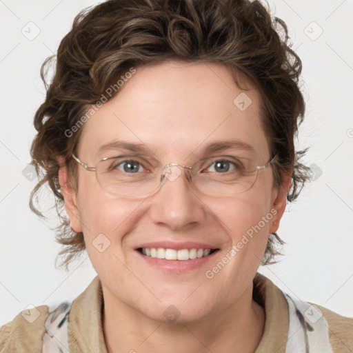 Joyful white adult female with medium  brown hair and blue eyes