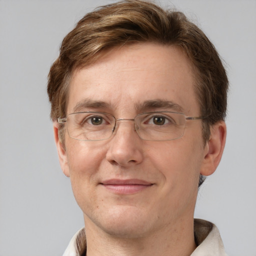 Joyful white adult male with short  brown hair and grey eyes