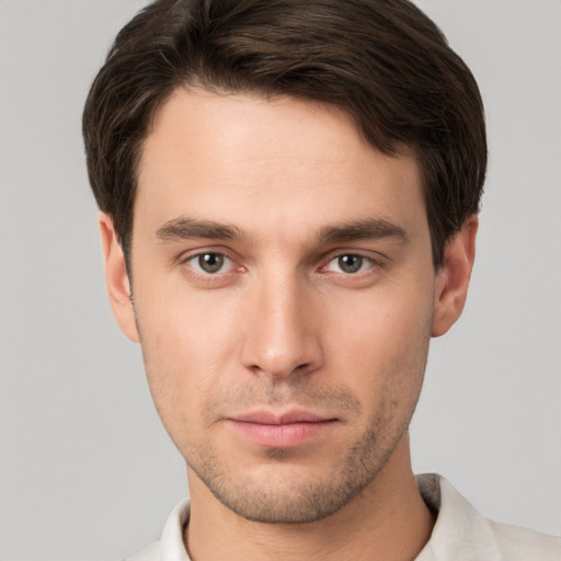 Neutral white young-adult male with short  brown hair and brown eyes