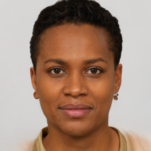 Joyful black young-adult female with short  brown hair and brown eyes