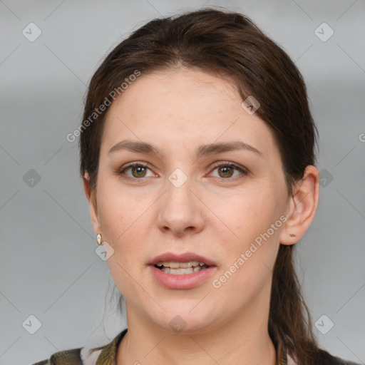 Joyful white young-adult female with medium  brown hair and grey eyes