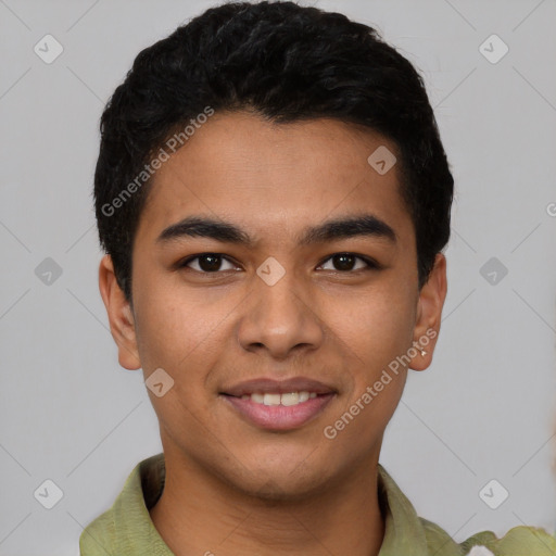 Joyful latino young-adult male with short  black hair and brown eyes