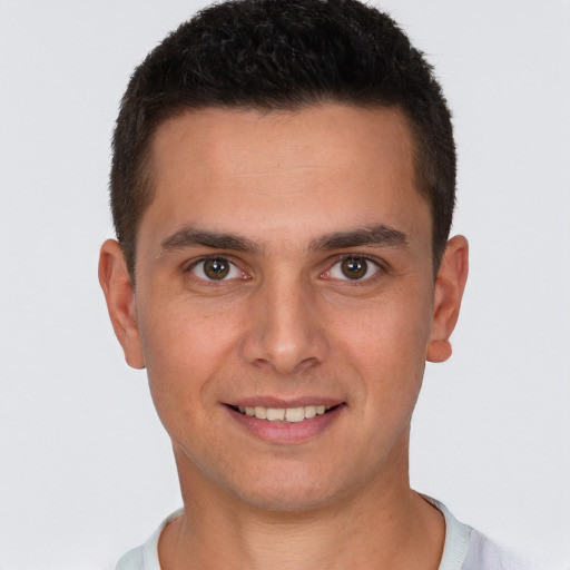 Joyful white young-adult male with short  brown hair and brown eyes