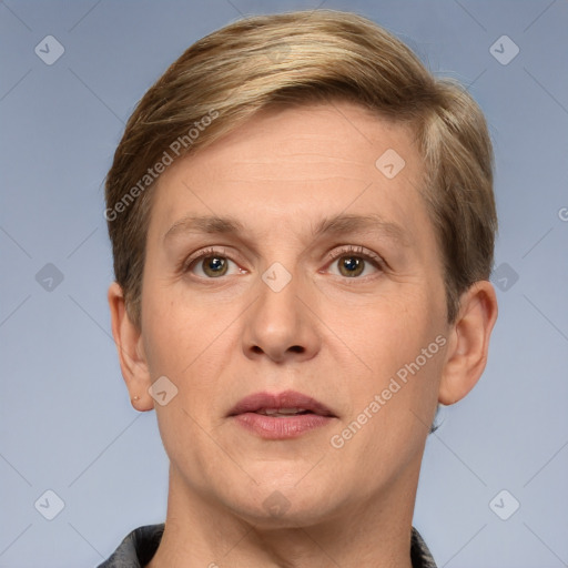 Joyful white adult female with short  brown hair and grey eyes