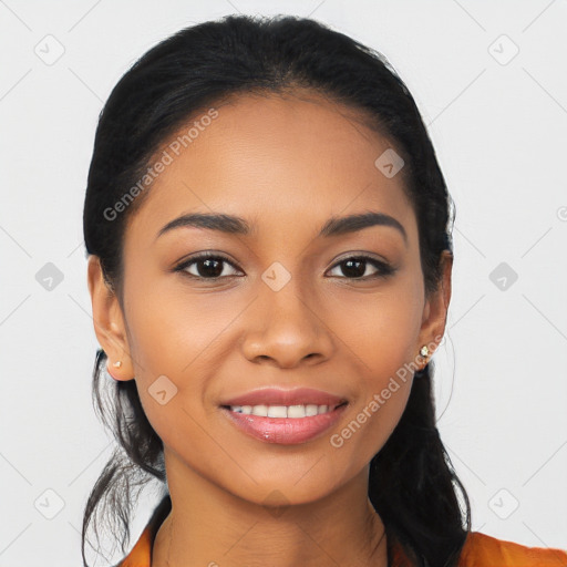 Joyful latino young-adult female with long  black hair and brown eyes