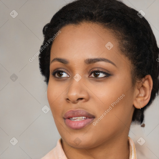 Joyful black young-adult female with medium  black hair and brown eyes