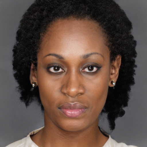 Neutral black young-adult female with short  black hair and brown eyes