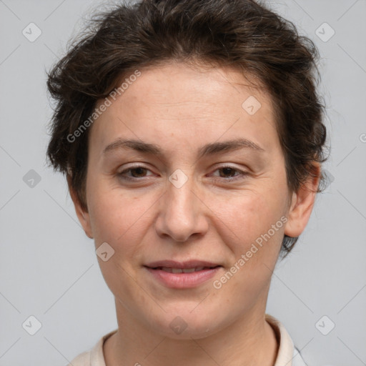 Joyful white adult female with short  brown hair and brown eyes