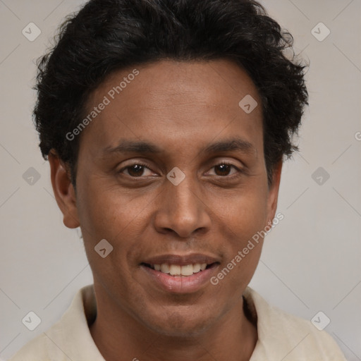 Joyful black young-adult male with short  brown hair and brown eyes