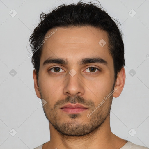 Neutral latino young-adult male with short  black hair and brown eyes