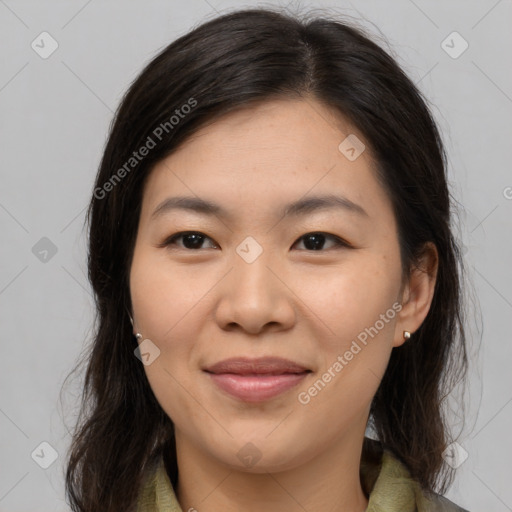 Joyful asian young-adult female with medium  brown hair and brown eyes