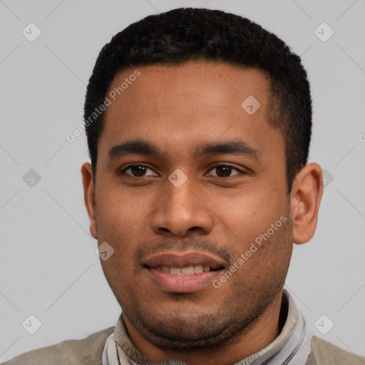 Joyful latino young-adult male with short  black hair and brown eyes