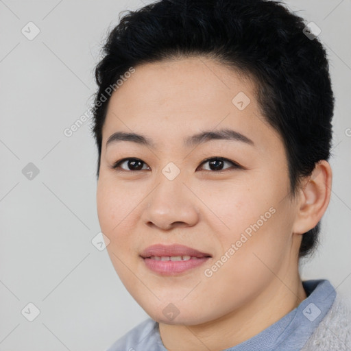 Joyful asian young-adult female with short  black hair and brown eyes