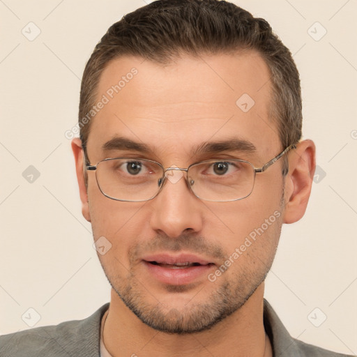 Joyful white adult male with short  brown hair and brown eyes