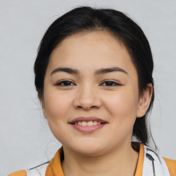 Joyful asian young-adult female with medium  black hair and brown eyes