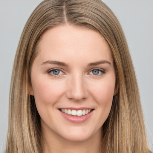 Joyful white young-adult female with long  brown hair and grey eyes