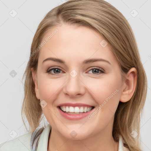 Joyful white young-adult female with medium  brown hair and blue eyes