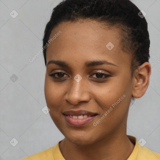 Joyful black young-adult female with short  brown hair and brown eyes