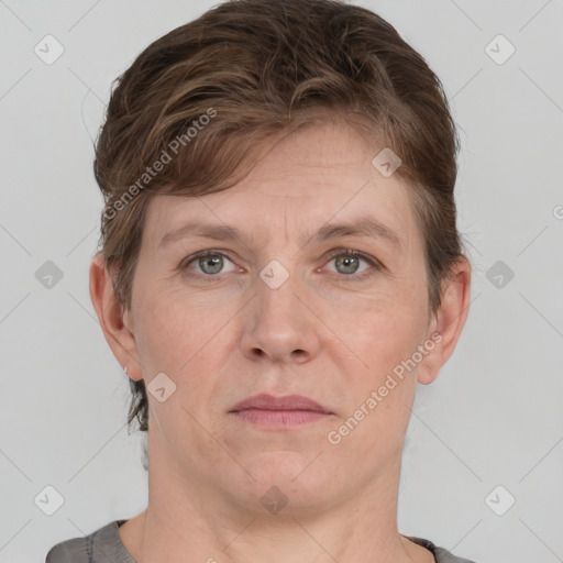 Joyful white adult female with short  brown hair and grey eyes