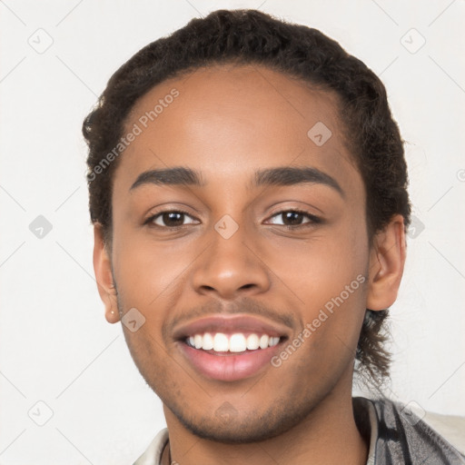 Joyful latino young-adult male with short  brown hair and brown eyes