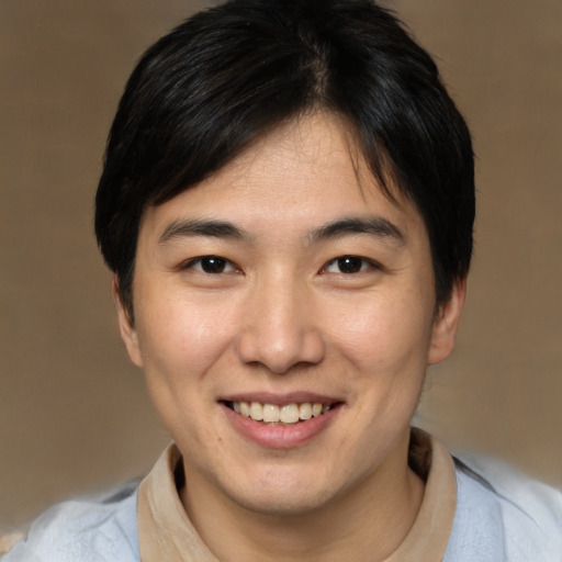 Joyful white young-adult male with medium  brown hair and brown eyes
