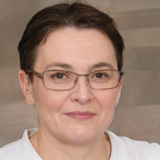 Joyful white adult female with short  brown hair and brown eyes