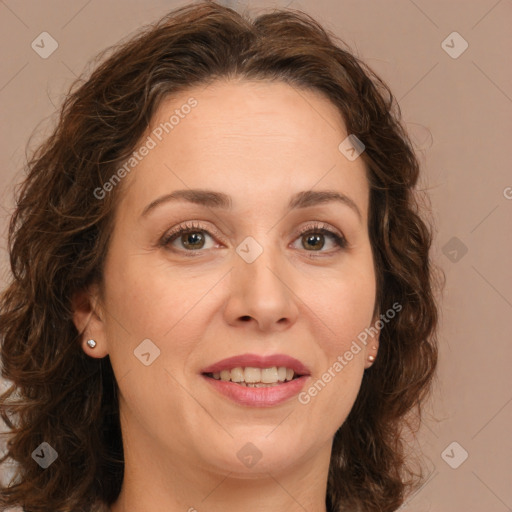 Joyful white adult female with long  brown hair and brown eyes