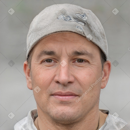 Joyful white adult male with short  brown hair and grey eyes