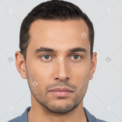 Neutral latino young-adult male with short  brown hair and brown eyes