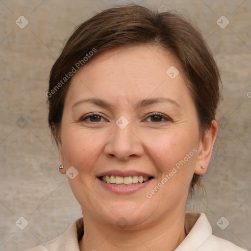 Joyful white adult female with medium  brown hair and brown eyes