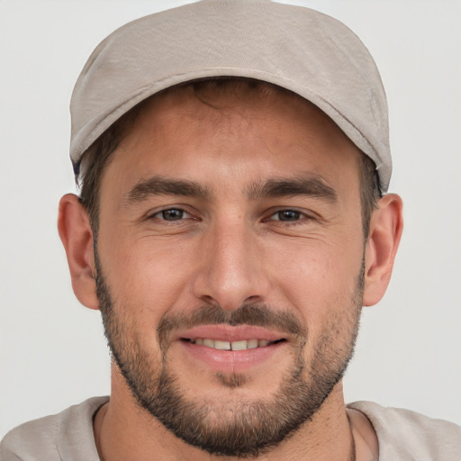 Joyful white young-adult male with short  brown hair and brown eyes