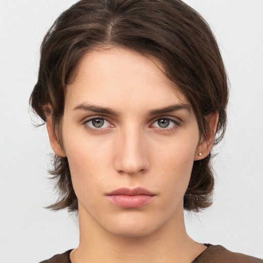 Neutral white young-adult female with medium  brown hair and brown eyes