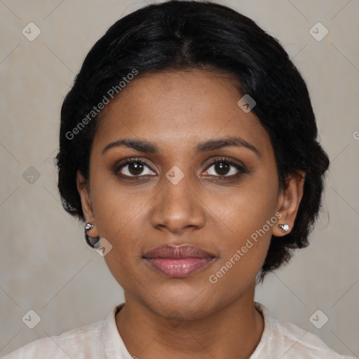 Joyful black young-adult female with medium  black hair and brown eyes