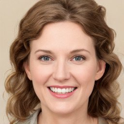 Joyful white young-adult female with medium  brown hair and green eyes