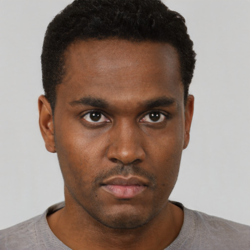 Neutral black young-adult male with short  black hair and brown eyes