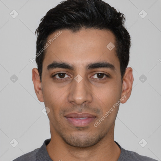 Joyful latino young-adult male with short  black hair and brown eyes