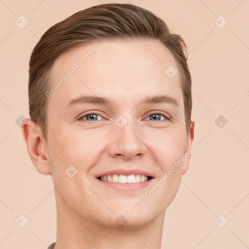 Joyful white young-adult male with short  brown hair and grey eyes