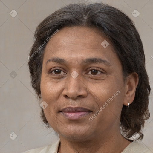 Joyful white adult female with medium  brown hair and brown eyes